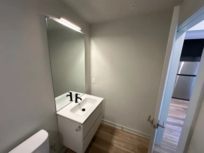 Newly finished modern half bath with floating vanity