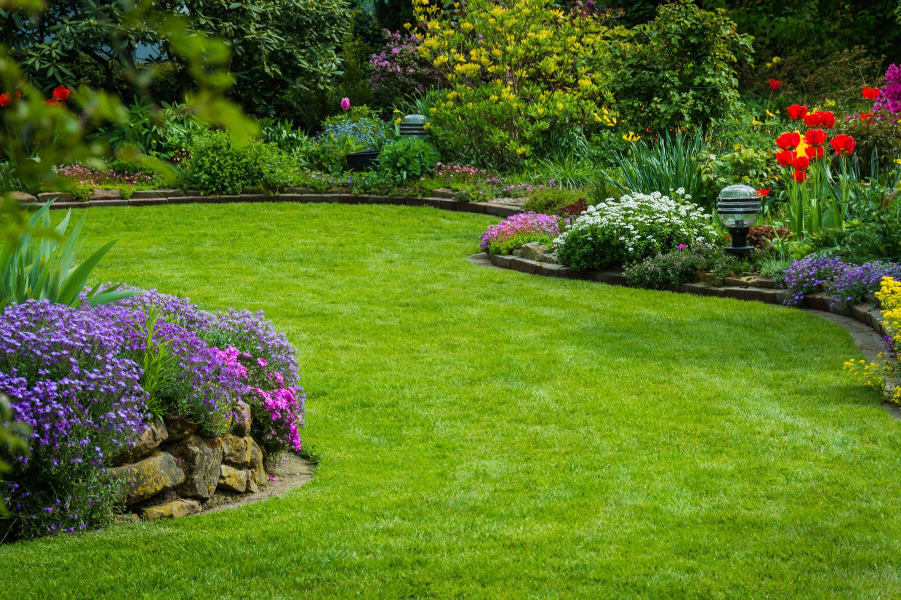 Manicured landscape with curved beds